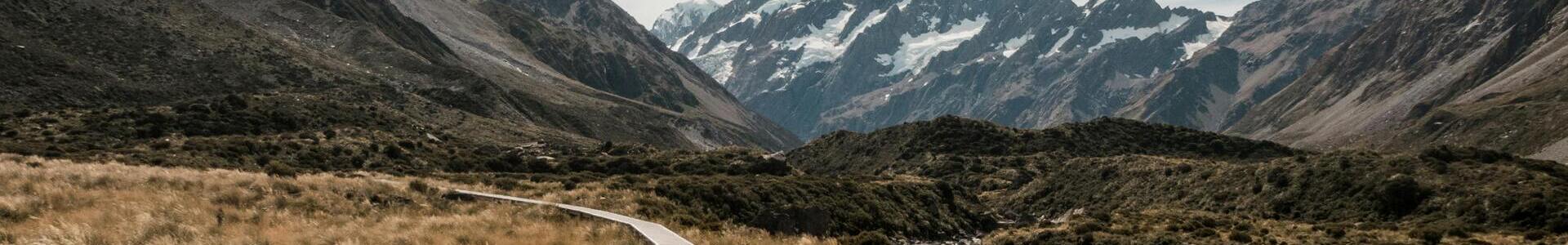 A horizontal banner image depicting a snowy mountain.