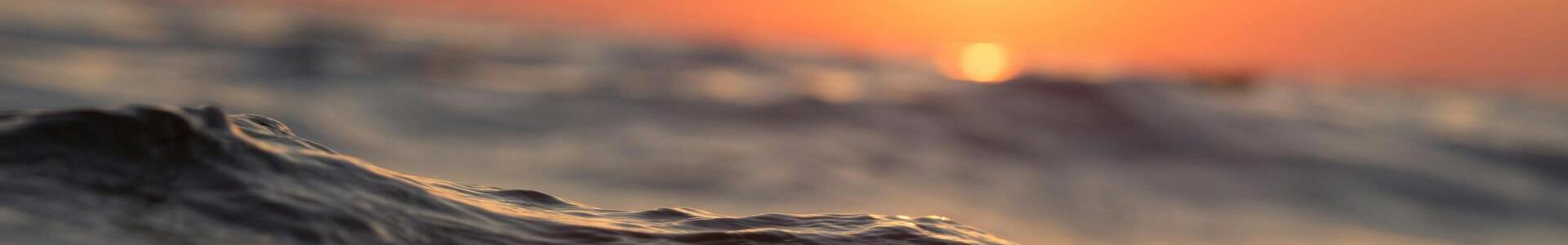 A horizontal banner depicting an expansive ocean scenery.